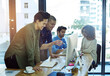 © peopleimages.com - Computer, design and pointing with business people in office for collaboration or decision. Agency, productivity and teamwork with happy creative employee group at work for project management