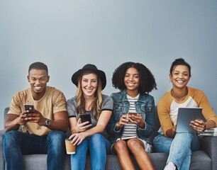 Aufkleber - Portrait, smartphone and group with tech, studio and smile for communication on break, relax or online. Happy, Gen z and people with social media, digital and friends with app for texting or internet