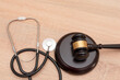 © Renata Hamuda - A gavel and stethoscope on wooden background, The law in medicine and medical negligence