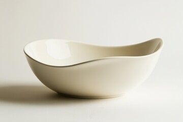 Poster - Elegant curved white ceramic bowl displayed on a neutral background showcasing its minimalist design and smooth texture