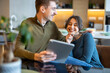 © Panorama - Happy couple in love surfing on tablet at home