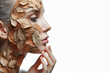 © Igor - A woman's face emerging from dry, withered leaves, symbolizing damaged skin isolated