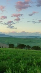 Wall Mural - tuscany hills landscape at sunrise, italy, zoom in timelapse. vertical video