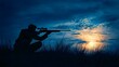 © chartchai - Silhouetted Hunter Aiming Rifle in Dramatic Outdoor Sunset Scenery