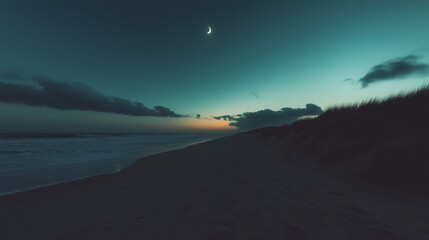 Wall Mural - a tranquil beach scene at twilight with a crescent moon and gentle waves.
