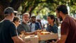 © mirifadapt - group of volunteers distributing food to the homeless, smiling warmly