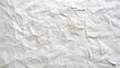 © WutStock01 - A textured, wrinkled white paper sheet lies flat, with a smaller piece of paper partially protruding from one edge, creating an intriguing contrast in shapes and layers.