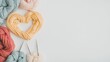 © VaVu  - Colorful yarn heart with knitting needles: creative crafting and diy inspiration