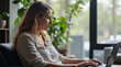 © елена калиничева - Young woman typing on laptop in bright home office with plants. Natural light from windows, modern workspace concept, productivity theme