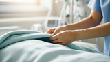 Healthcare worker making bed in hospital setting