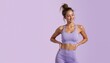 © schiers_images - Fit young woman in lavender workout clothes standing confidently on a solid purple background.