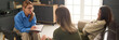 © Mediaphotos - Header image of female therapist consulting mother and daughter fighting during family counseling session