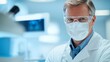 © Olha - Photograph of a professional dentist in a modern dental clinic, wearing a clean white coat, protective gloves, a face mask, and safety glasses.