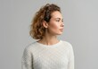 © Rizka - Profile of a woman in a knitted sweater