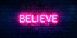 © CYBERUSS - Minimalist Neon Sign Displaying the Word  Believe  Against Brick Wall