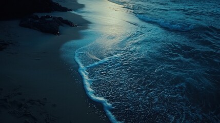 Wall Mural - Serene twilight beach scene, waves gently lapping shore.