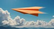 © Nina - Orange paper airplane flying through the sky with clouds in a dynamic and artistic representation