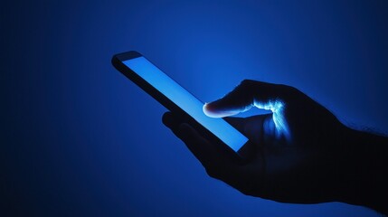 Engaging smartphone usage in a dark ambience showcasing a modern application on a glowing digital display