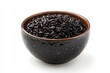 © Natchanok - Organic black rice served in rustic bowl against a plain white background showcasing natural food ingredient and healthy eating choice