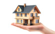 © Sumon Creative - A hand holding a model of a house, against a white background, isolated on transparent background PNG