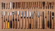 © Poonnoi - Cutting tools for wood and metal arrangement workshop tool collection organized workspace overhead view precision crafting