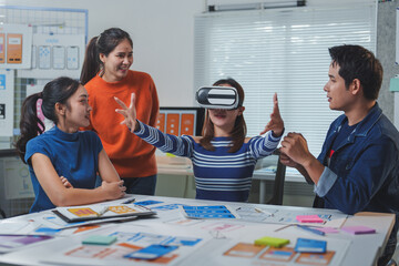 Wall Mural - ui and ux designers collaborating in a modern office, testing a virtual reality application, discuss