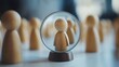 © Nattapat - A magnified wooden figure viewed through a glass lens, surrounded by blurred figures on a smooth white surface, emphasizing precision and minimalist design