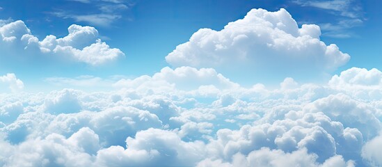 Poster - Serene blue sky filled with soft white fluffy clouds in the upper half of the image creating a peaceful and tranquil atmosphere for backgrounds