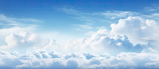 Poster - Vibrant blue sky with fluffy white clouds occupying the upper third, creating serene and expansive copy space ideal for showcasing text.
