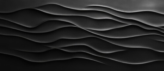 Fototapete - Textured black clay background featuring smooth wavy patterns with variations in light and shadow creating depth and visual interest