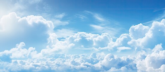 Poster - Serene blue sky with soft white clouds in gradient light displaying calmness and beauty during spring or summer atmospheric conditions