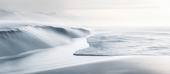Poster - Gentle waves create soft foam on a serene white sandy shore under a soft light with a minimalist composition emphasizing tranquility and beauty.