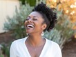 © Diio - Joyful Woman Laughing Outdoors