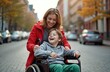 © Vadym - Mother pushing son in wheelchair along city street. Disabled child smiling with mom. Happy family enjoy time together outdoor. Inclusive care concept, child disease rehabilitation, medical assistance.