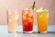 © Rachanon - Stylish trio of iced drinks against a neutral backdrop, cool, color, mocktail