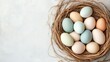 © Artittaya - A cozy basket filled with matte pastel eggs, carefully arranged on a neutral white background