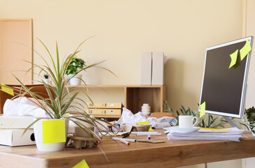 messy workplace with crumpled paper and garbage in office