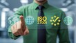 © Onetrick  - Person using virtual touch screen push text: ISO 27001. ISO 27001 Standard certification standardisation quality control concept. ISO 27001 certified for information security management system new