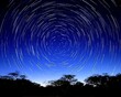 © yogiandrias - Long exposure photograph depicting the circular movement of stars at night