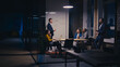 © HudHudPro - Diverse business team discussing artificial intelligence in a modern office at night. Concept of teamwork, corporate strategy, and AI technology in professional settings.