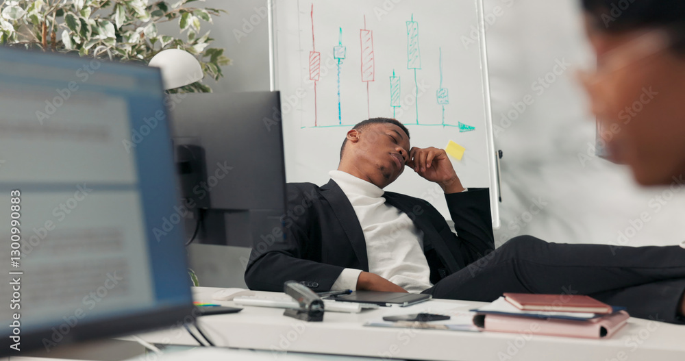 Compani Boss Dark-skinned handsome company boss sits comfortably in chair with feet ...
