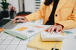 © Dino - Portrait of a woman working on a tablet computer in a modern office. Make an account analysis report. real estate investment information financial and tax system concepts