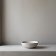 © Sekai - White ceramic bowl against a blank wall, symbolizing purity and elegance for minimalist interiors
