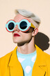 © BubbleSnap - A Stylish Person with Bold Fashion Choices and Round Blue Glasses