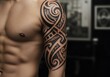 © RightPurpose - Tribal Tattoo: Bold Black Ink Design on Muscular Arm