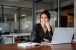 © Stock 4 You - Smiling professional financial it specialist latin hispanic business lady working on laptop pc sitting in office. Middle eastern indian woman dreaming using computer technology app for work online