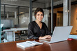 © Stock 4 You - Portrait 30s latin hispanic business woman manager working on laptop computer in modern office. Smiling Indian young businesswoman professional entrepreneur using pc app at workplace looking at camera