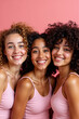 © Stock Image Paradise - Cheery Smiling Multiethnic Girls Posing Together Against Pink Wall