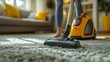 © vannet - Women using carpet in living room to clean vacuum cleaners.