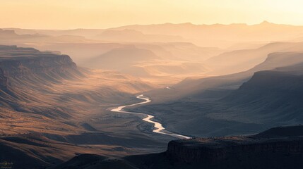 Wall Mural - Serene sunset over a winding river in a vast canyon.